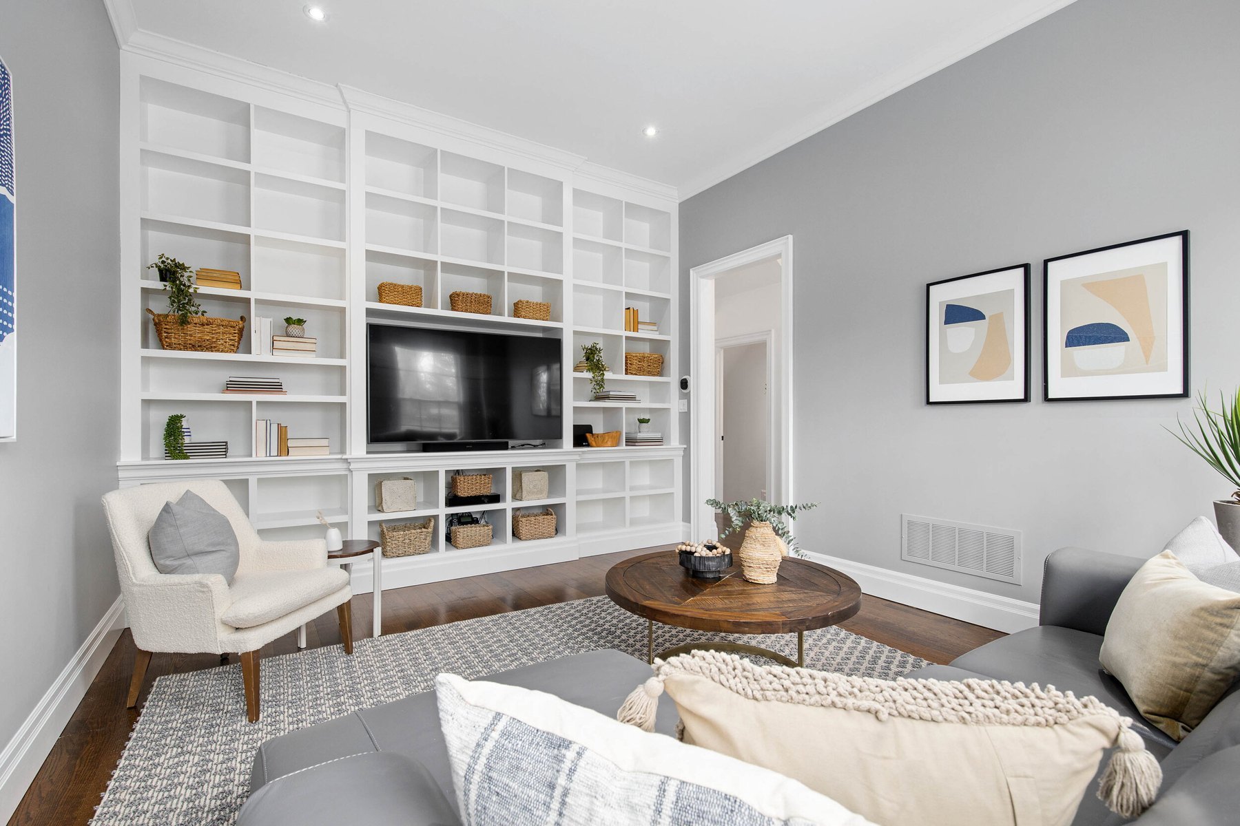 Bright living room with built-in cabinetry