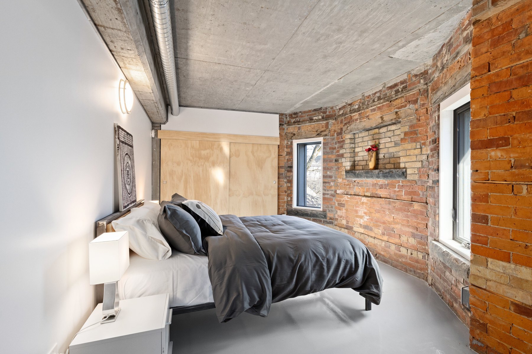 Bedroom with exposed brick